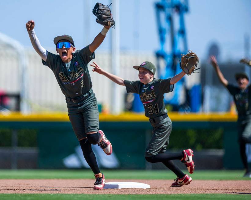 Nevada infielder Russell McGee (2) makes the final out at second base and celebrates with infie ...