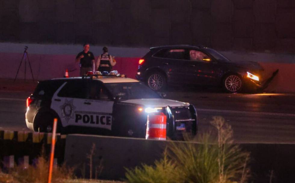 Police investigate a shooting on Interstate 15 southbound on Thursday, Aug. 8, 2024, in Las Veg ...