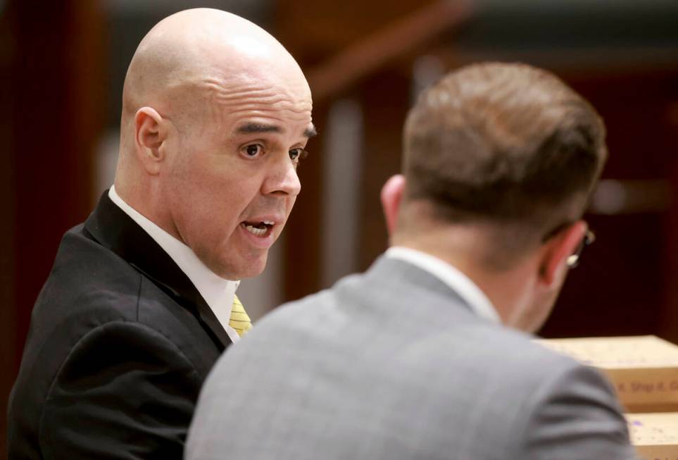 Robert Telles, left, speaks with attorney Michael Horvath on the first day of jury selection fo ...