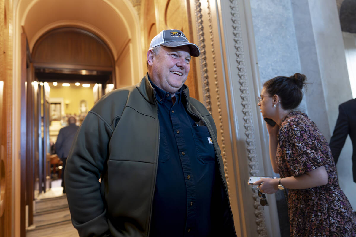 FILE - Sen. Jon Tester, D-Mont., leaves the chamber as the Senate prepares to advance the $95 b ...