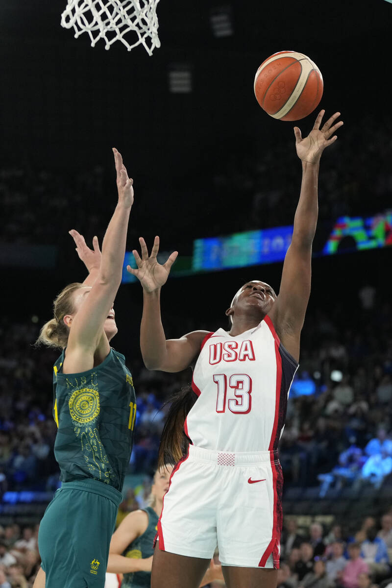 United States' Jackie Young (13) goes up for a basket against Alanna Smith (11), of Australia, ...