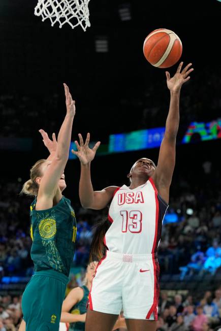 United States' Jackie Young (13) goes up for a basket against Alanna Smith (11), of Australia, ...