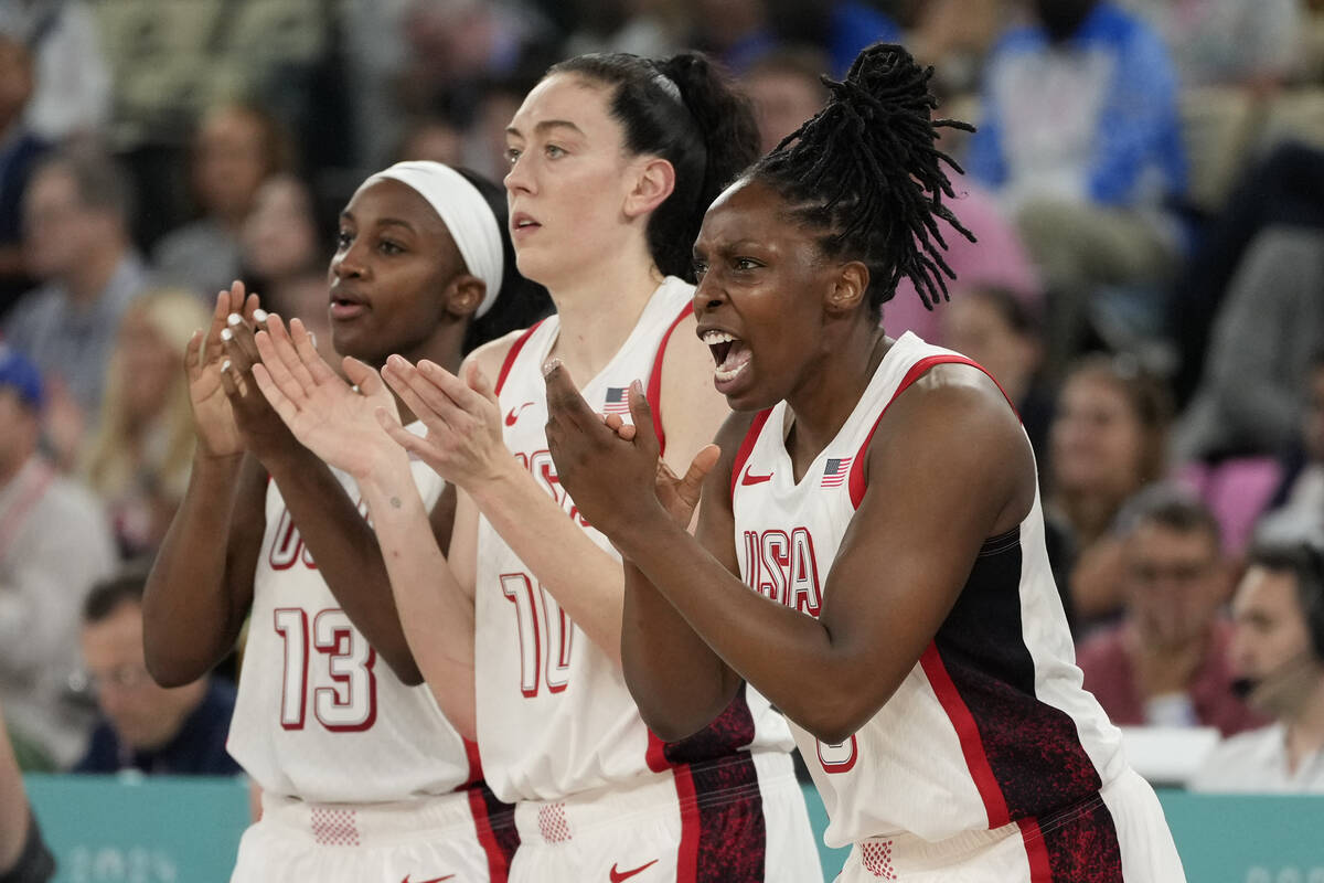 United States' Jackie Young (13), Breanna Stewart (10) and Chelsea Gray (8) celebrate as Austra ...