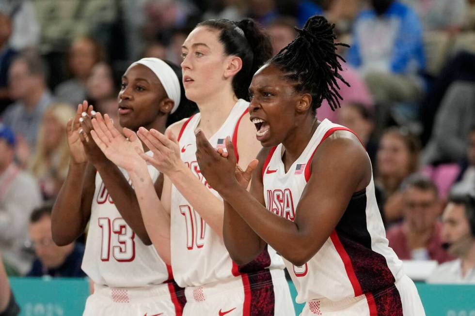 United States' Jackie Young (13), Breanna Stewart (10) and Chelsea Gray (8) celebrate as Austra ...