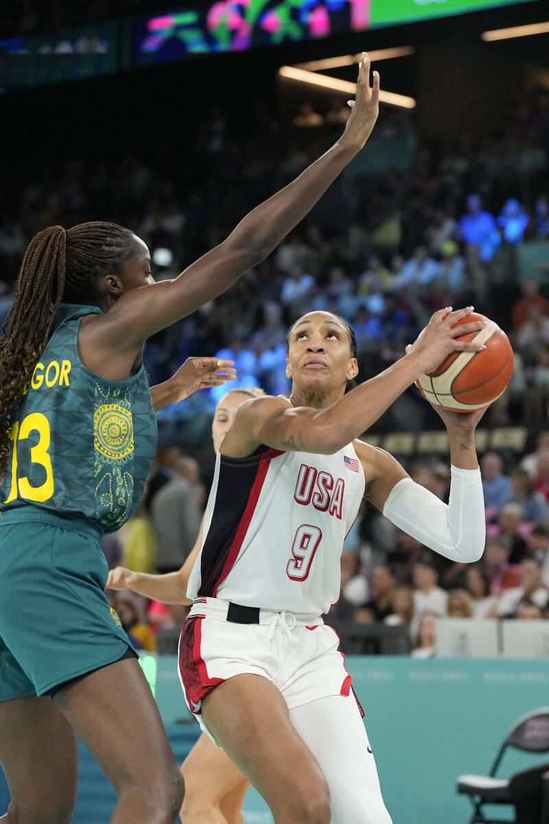 United States' A'ja Wilson (9) goes up against Ezi Magbegor (13), of Australia, during a women' ...