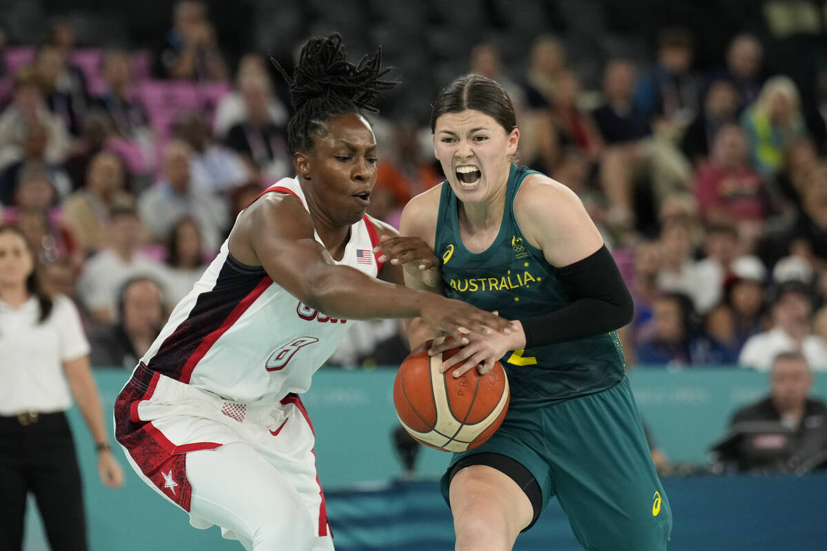 Jade Melbourne (2), of Australia, and United States' Chelsea Gray (8) battle for possession dur ...