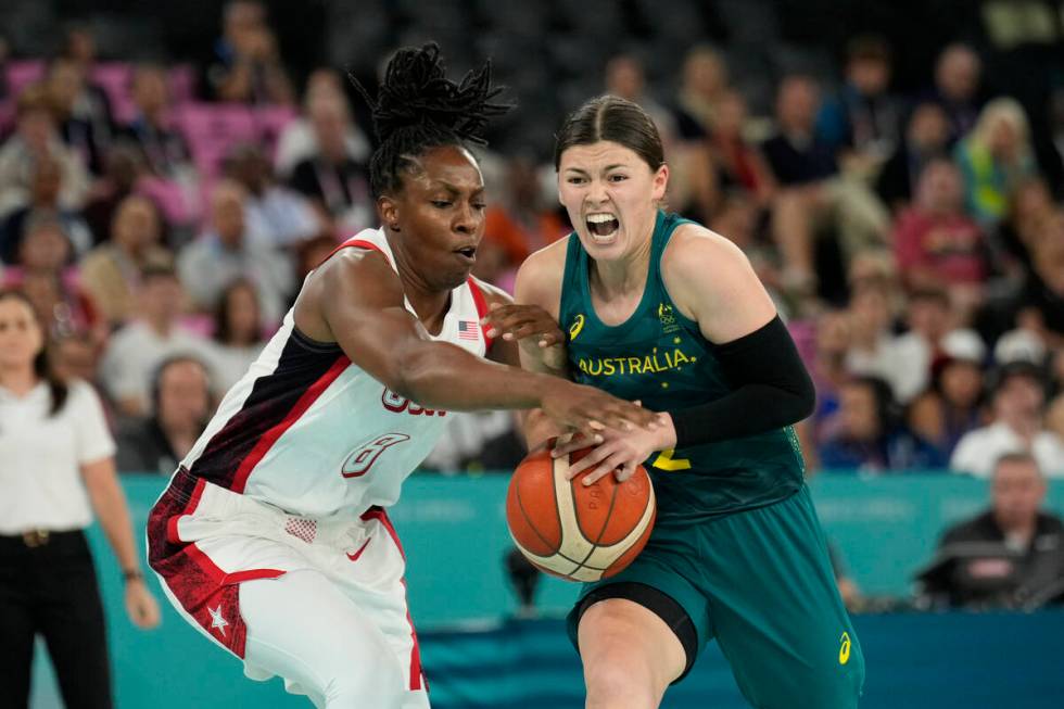 Jade Melbourne (2), of Australia, and United States' Chelsea Gray (8) battle for possession dur ...