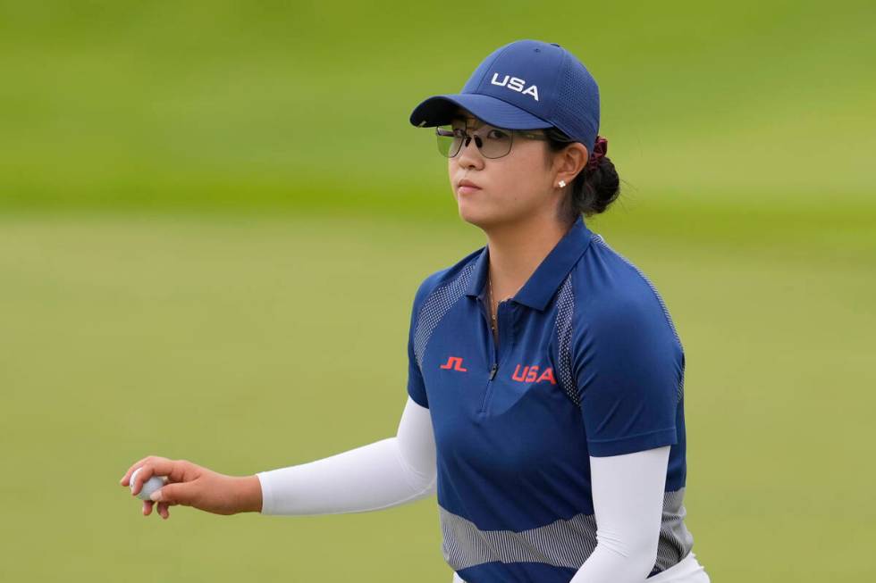 Rose Zhang, of the United States, acknowledges the crowd after after making par on the 10th gre ...