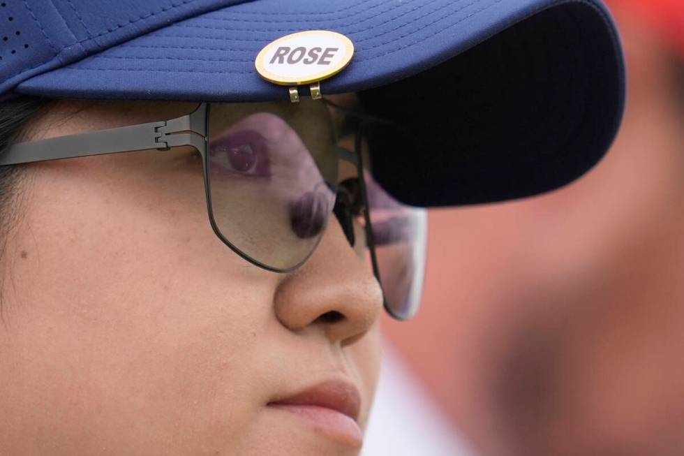 Rose Zhang, of the United States, looks down the 12th hole from the tee, she is wearing a name ...