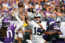 Las Vegas Raiders quarterback Gardner Minshew II (15) throws against the Minnesota Vikings duri ...