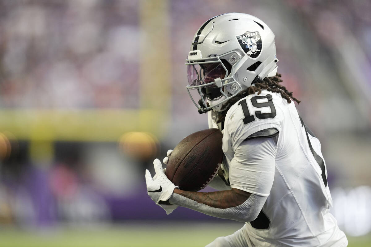 Las Vegas Raiders wide receiver DJ Turner (19) catches a pass for a touchdown against the Minne ...