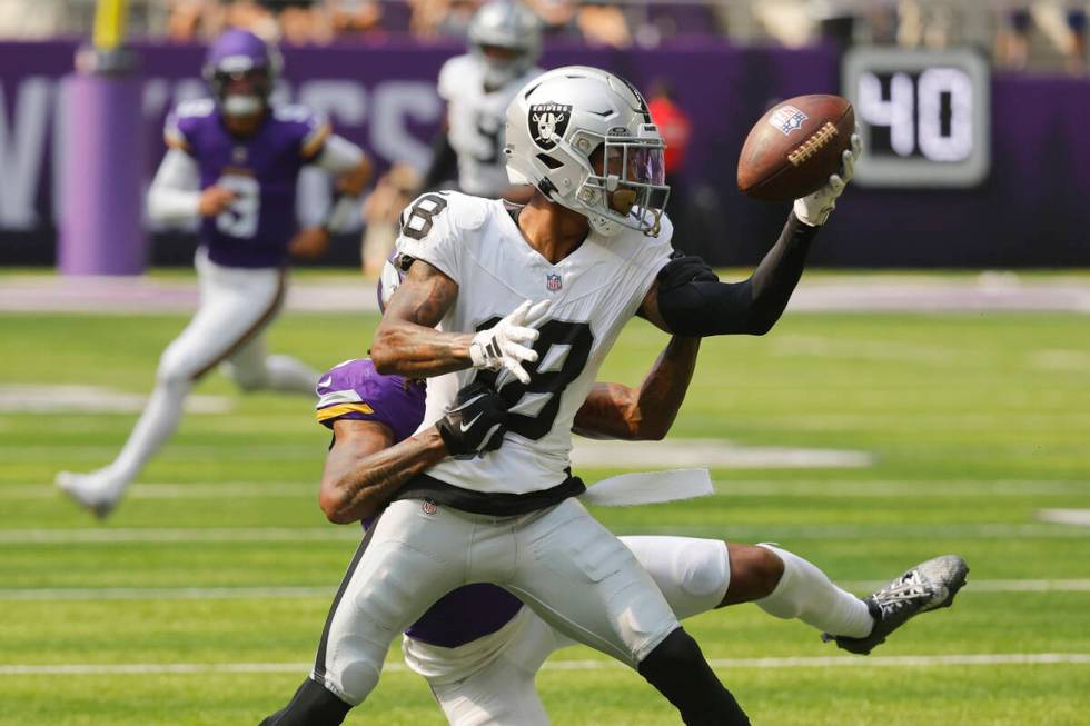 Las Vegas Raiders cornerback Jack Jones (18) intercepts a pass intended for Minnesota Vikings w ...