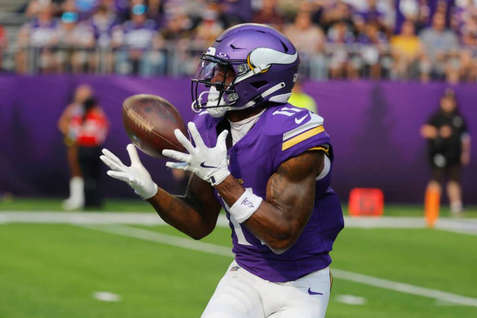 Minnesota Vikings wide receiver Trent Sherfield Sr. (11) pulls in a pass for a touchdown agains ...