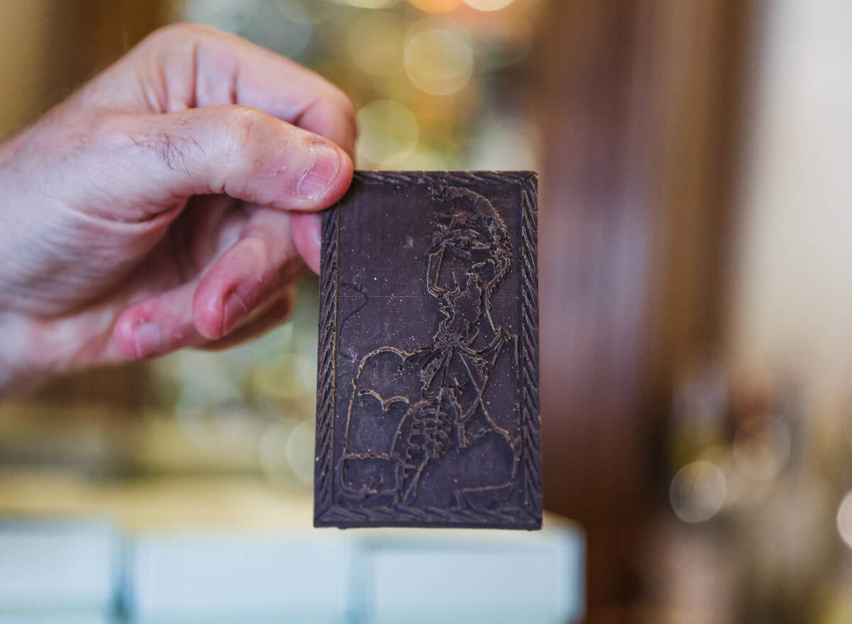 Server Alain Boscarolo holds up a piece of chocolate shaped as Pablo Picasso’s “S ...