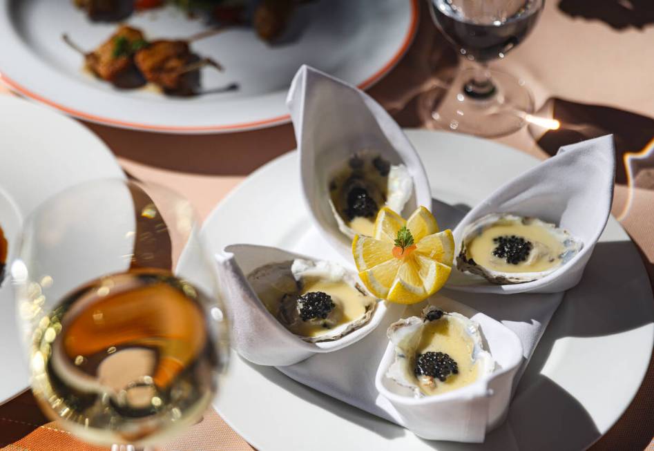 Poached oysters at Picasso at the Bellagio hotel-casino in Las Vegas, Thursday, Aug. 15, 2024. ...