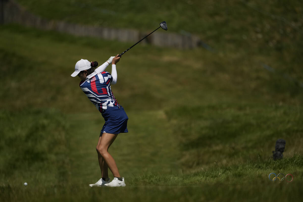 Rose Zhang, of the United States, hits her shot from the 3rd tee during the final round of the ...