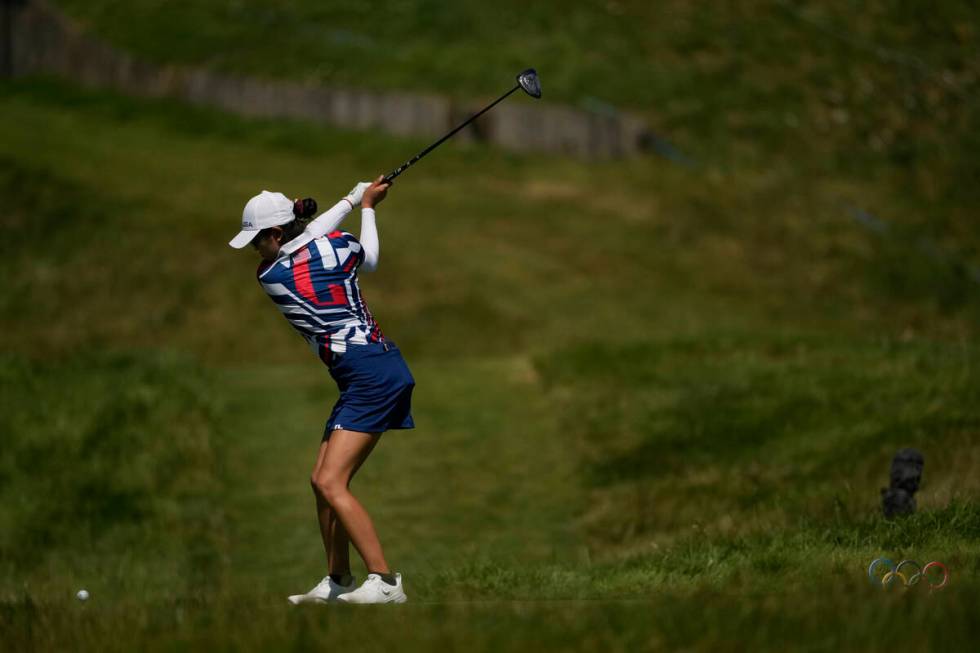 Rose Zhang, of the United States, hits her shot from the 3rd tee during the final round of the ...