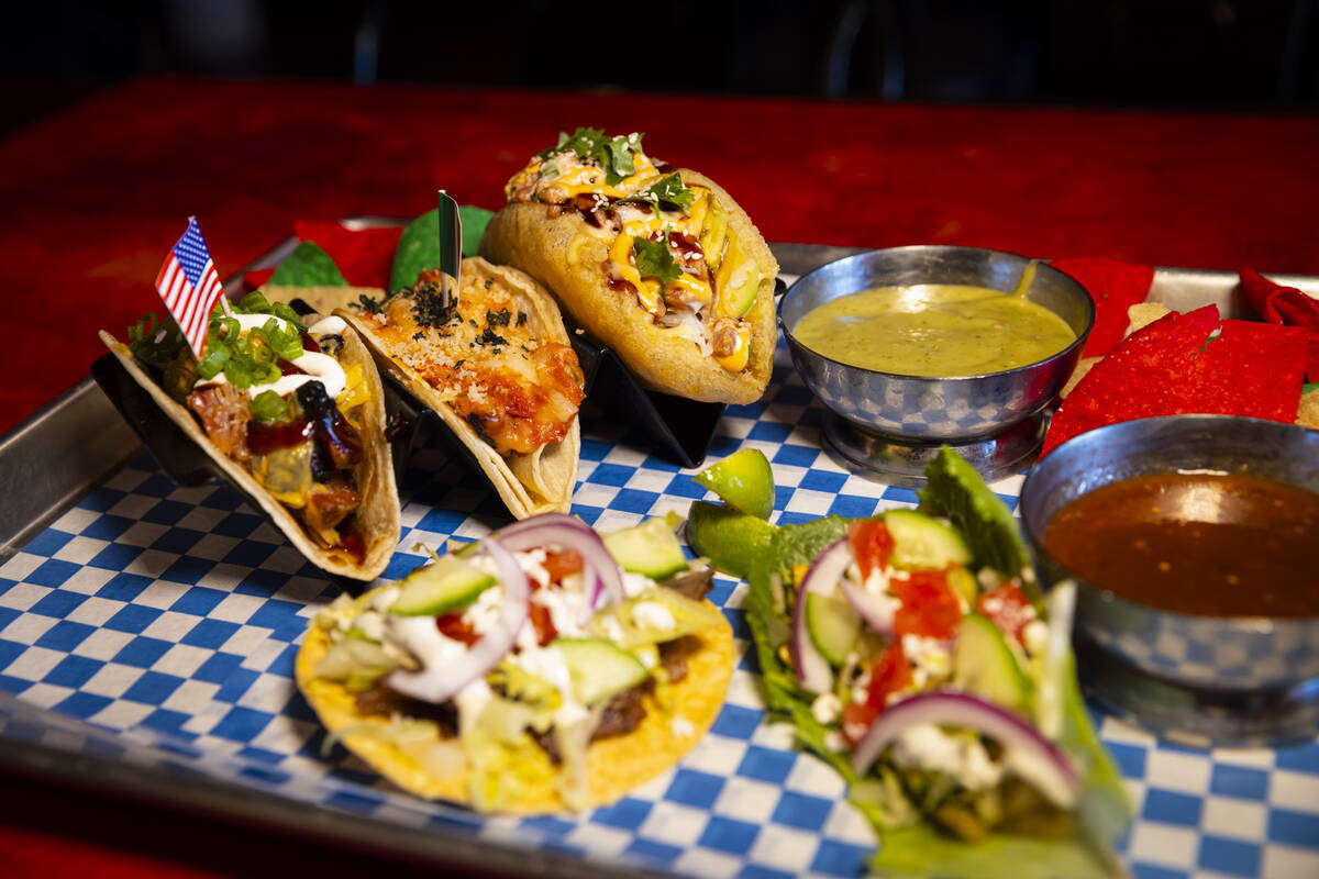 A plate of tacos with chips and salsa is seen at International Taco Co. on Wednesday, Aug. 14, ...