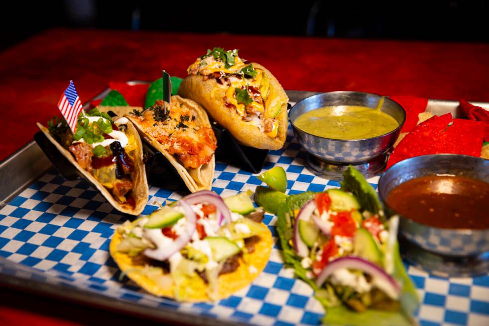 A plate of tacos with chips and salsa is seen at International Taco Co. on Wednesday, Aug. 14, ...