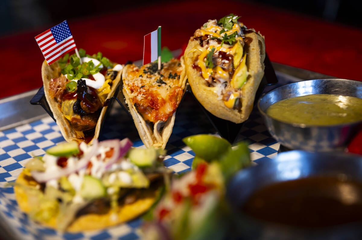 A plate of tacos with chips and salsa is seen at International Taco Co. on Wednesday, Aug. 14, ...