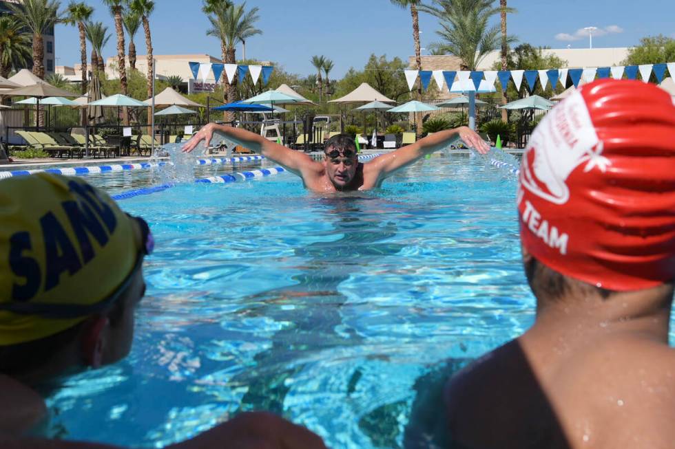 Current world record holder and 12-time Olympic medalist Ryan Lochte demonstrates butterfly str ...