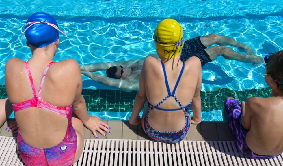 Current world record holder and 12-time Olympic medalist Ryan Lochte demonstrates a backstroke ...