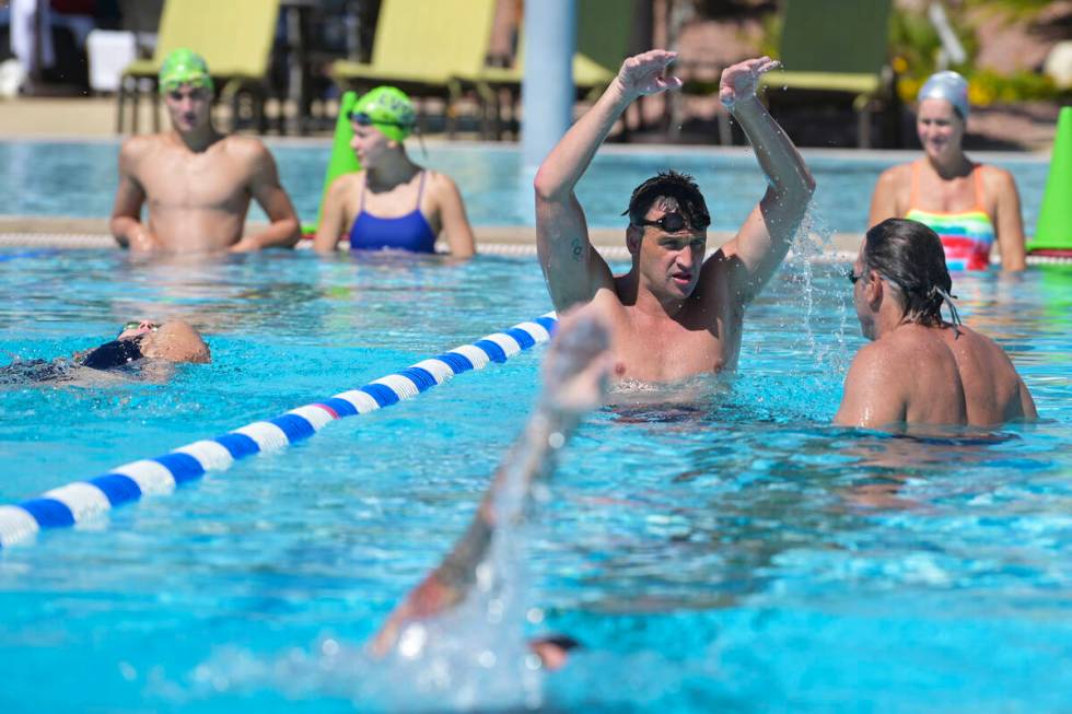 Current world record holder and 12-time Olympic medalist Ryan Lochte gives pointers during a sw ...