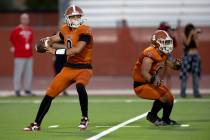 Legacy quarterback Aidan Crawford (9) prepares to throw while running back Phoenix Jennings (8) ...