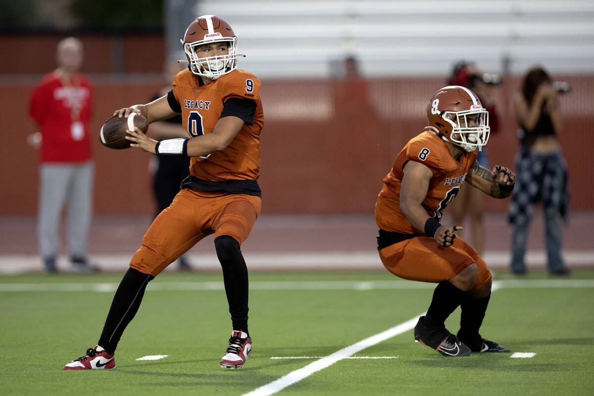 Legacy quarterback Aidan Crawford (9) prepares to throw while running back Phoenix Jennings (8) ...