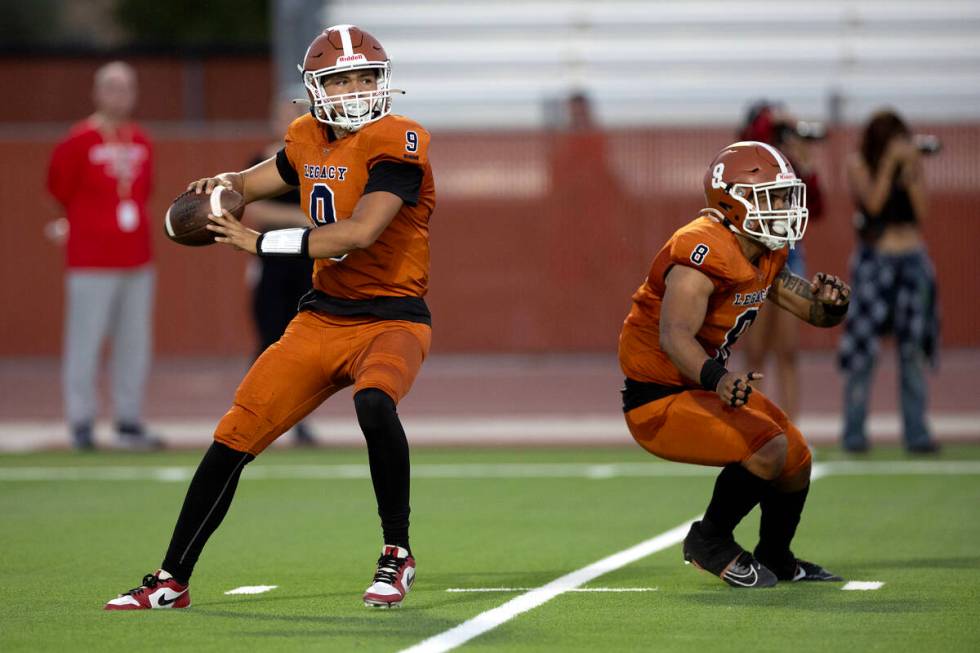 Legacy quarterback Aidan Crawford (9) prepares to throw while running back Phoenix Jennings (8) ...