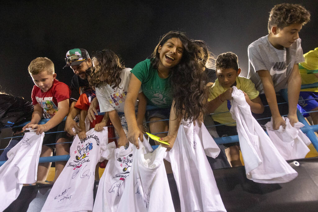 Young fans wait to have their shirts signed by Las Vegas Lights FC players after a USL Champion ...