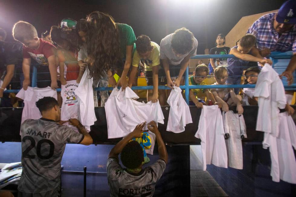 Young fans have their shirts signed by Las Vegas Lights FC players after a USL Championship soc ...