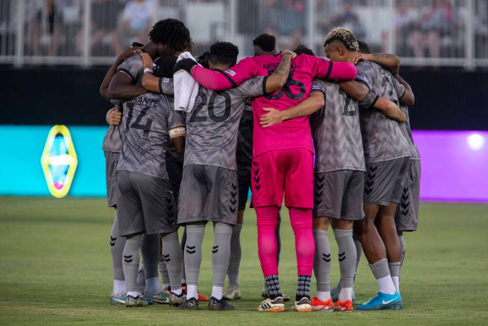 Members of the Las Vegas Lights FC huddle before a USL Championship soccer game against the Det ...