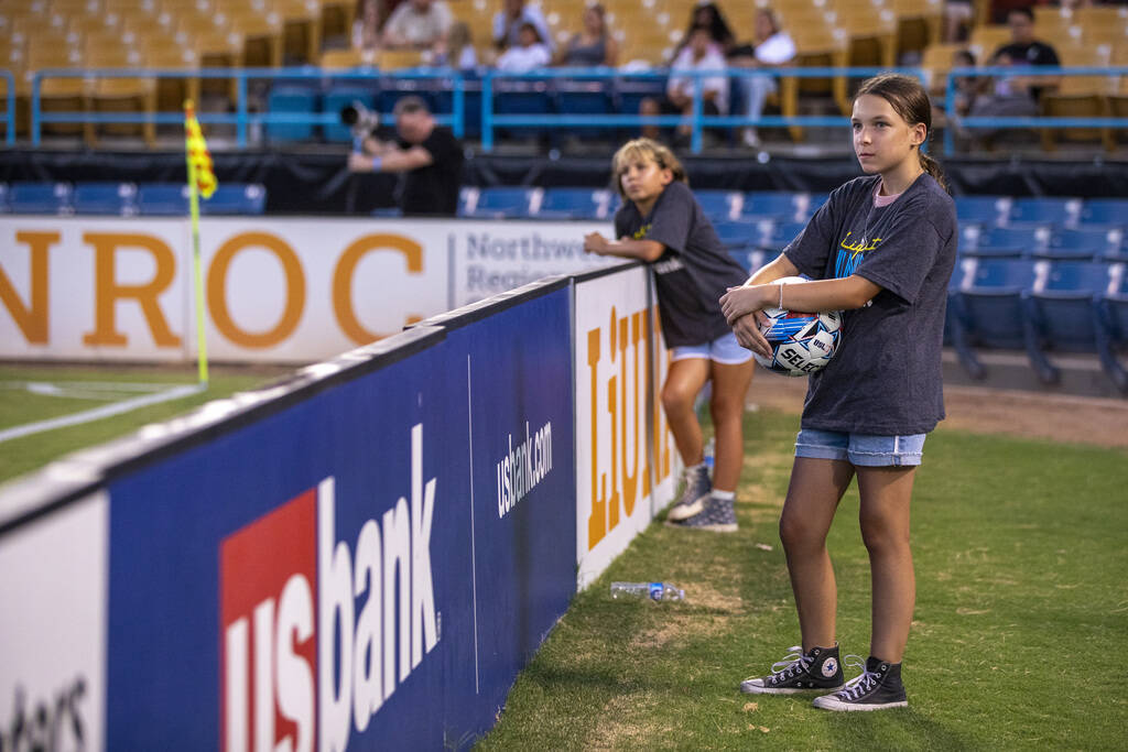 Ball girls wait at the corner of the pitch during a USL Championship soccer game between the La ...