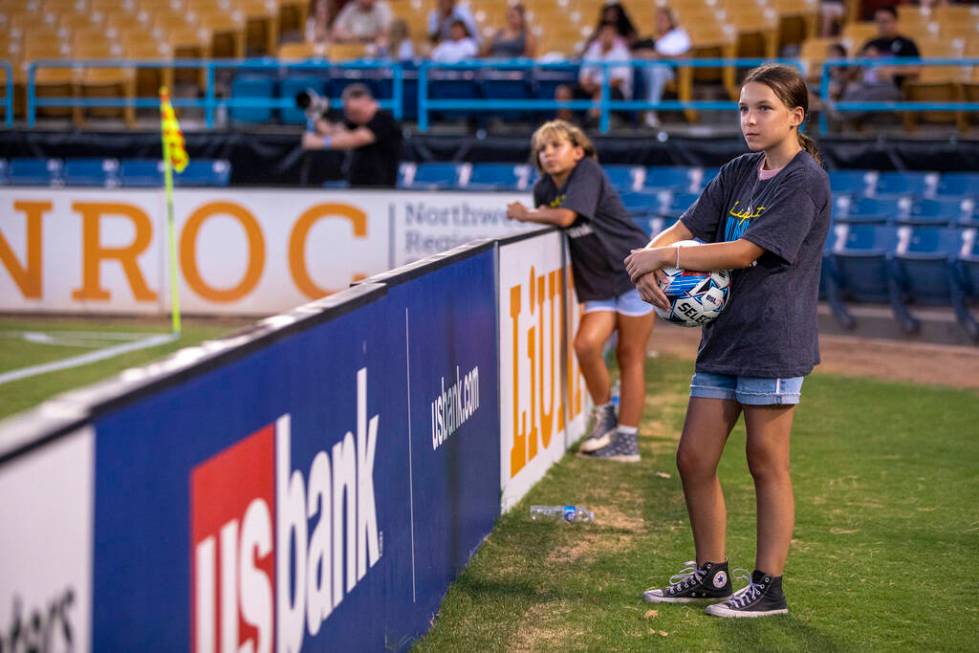 Ball girls wait at the corner of the pitch during a USL Championship soccer game between the La ...