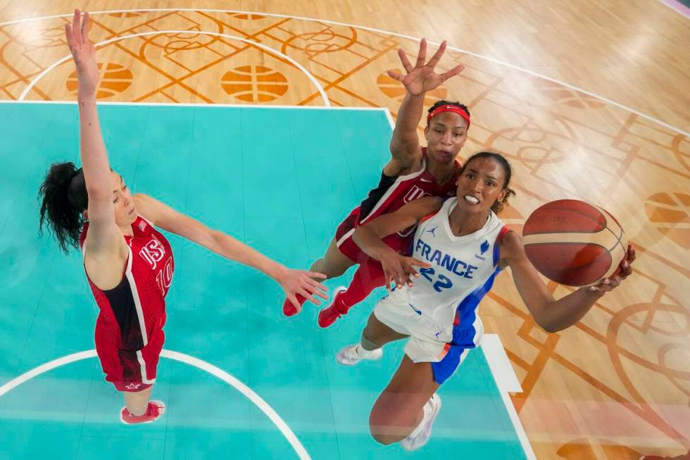 Marieme Badiane, right, (22), of France, shoots for a basket as United States' Breanna Stewart, ...