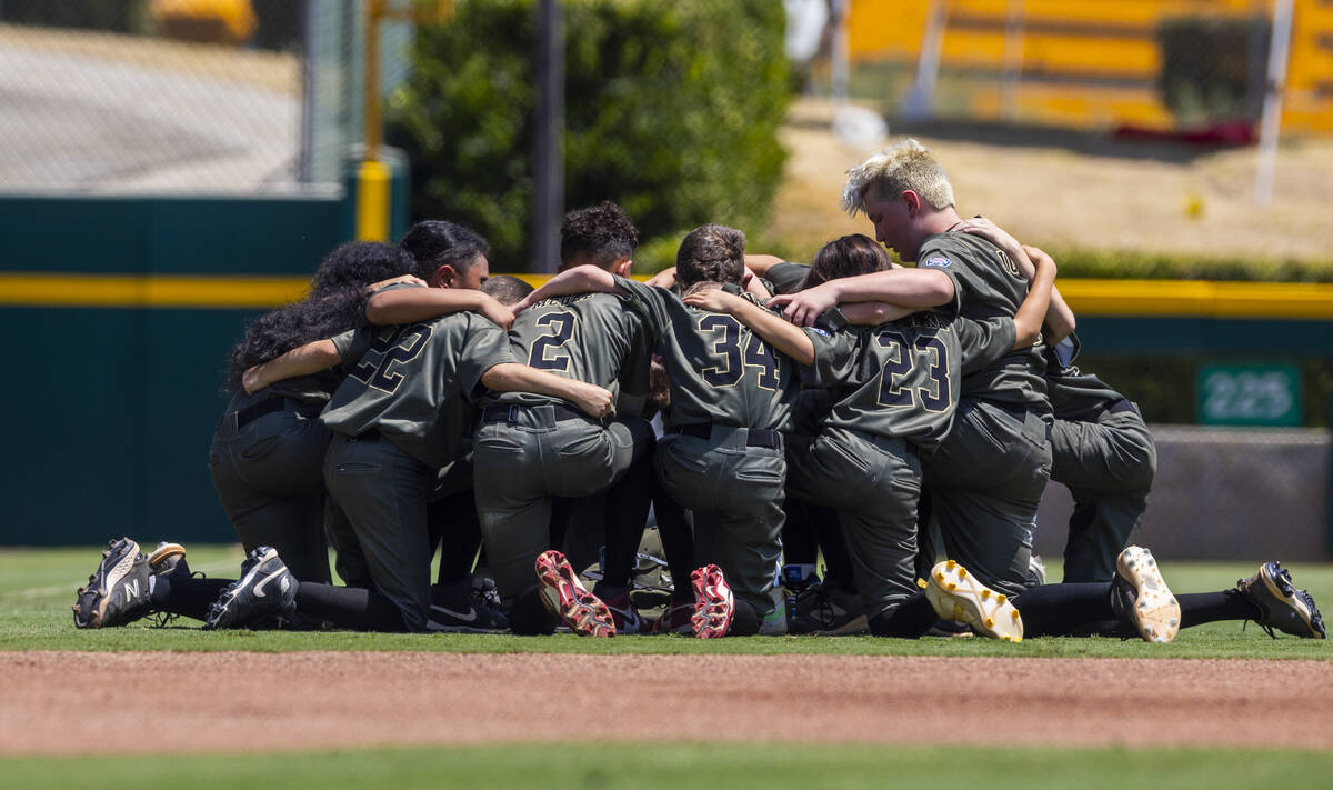 Nevada players gather as they ready to face Utah in the Mountain Regional final baseball game o ...