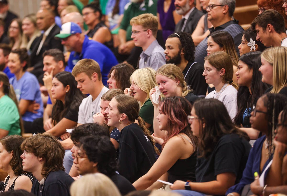 Students tear up during a memorial service for Eric Johnston, a former teacher and basketball c ...