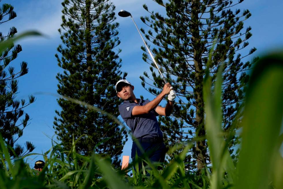 Collin Morikawa hits from the third tee during the first round of The Sentry golf event, Thursd ...