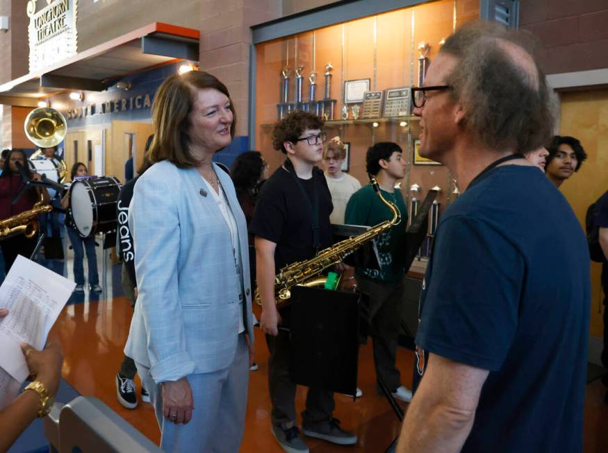 Interim Superintendent Brenda Larsen-Mitchell, left, speaks to Legacy High School music teacher ...