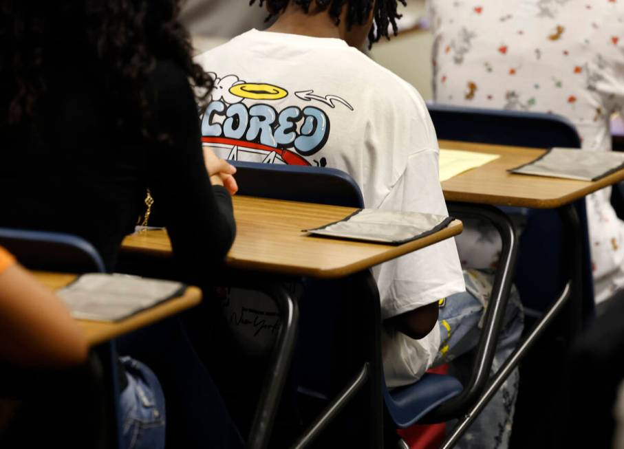 Cellphone pouches are displayed on Legacy High School students' desks during the first day of s ...