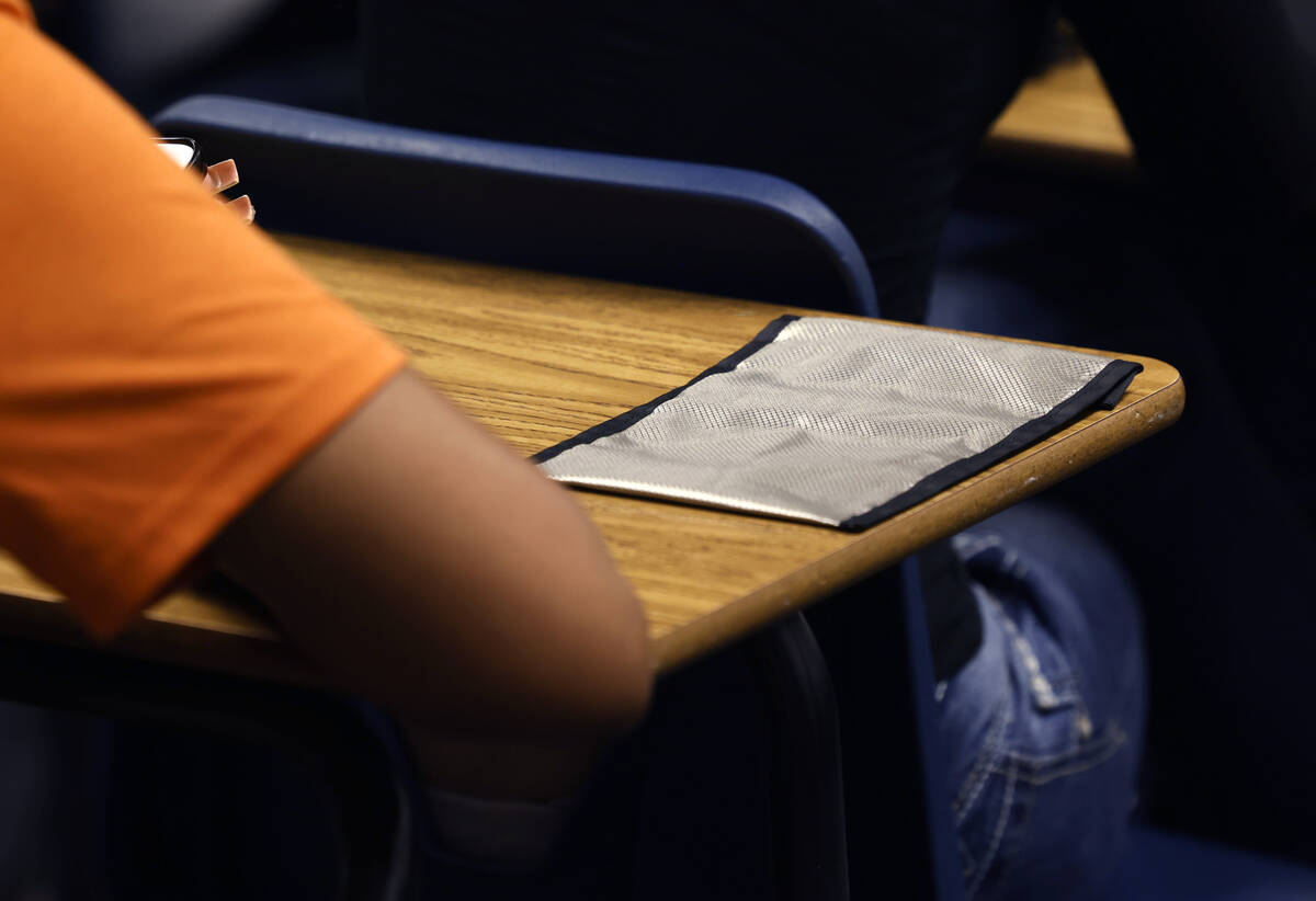 A cellphone pouch is display on Legacy High School student's desk during the first day of schoo ...