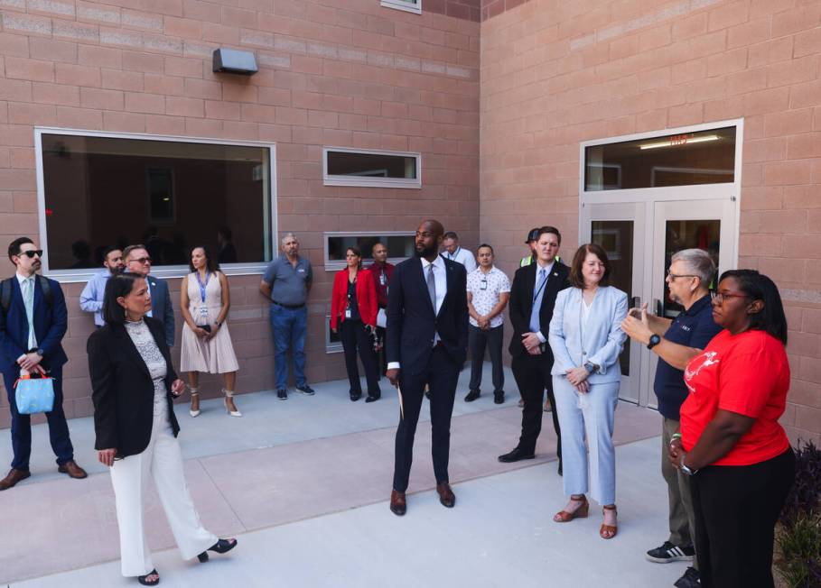 Public officials tour the newly rebuilt Red Rock Elementary School on the first day of school i ...