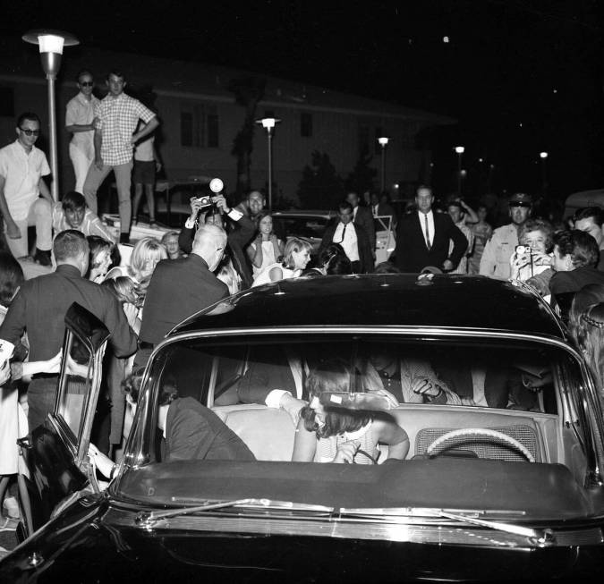 Fans swarm The Beatles a car transporting The Beatles. (LVCVA Archive / Las Vegas News Bureau C ...