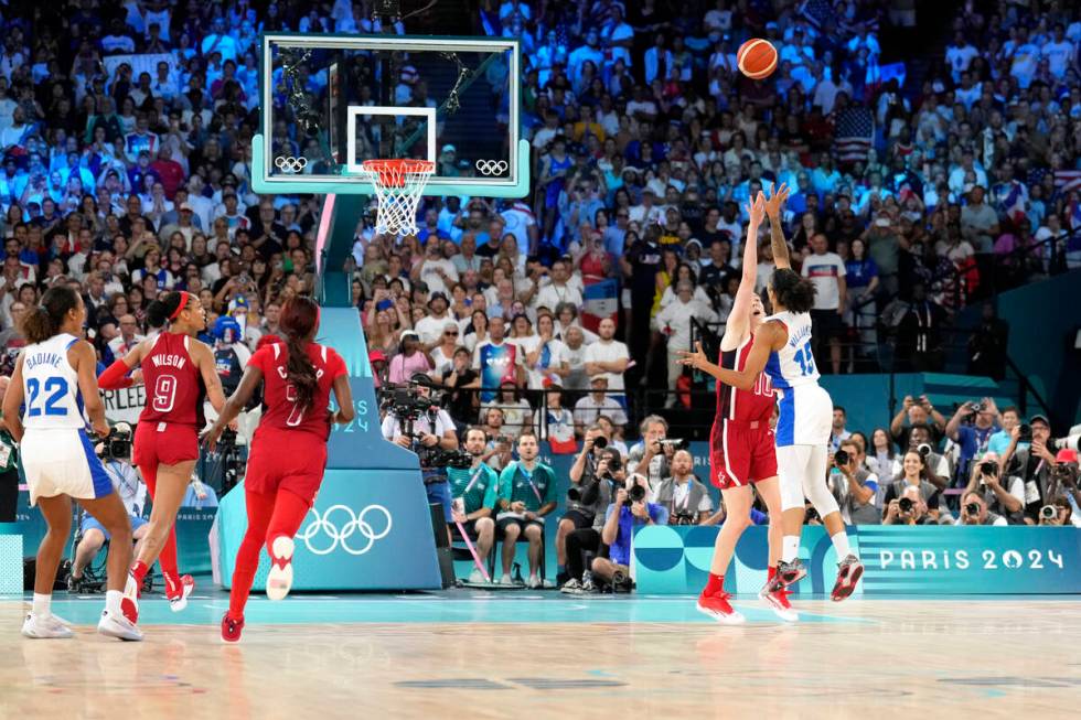 Gabby Williams (15), of France, makes a two-point basket to end a women's gold medal basketball ...