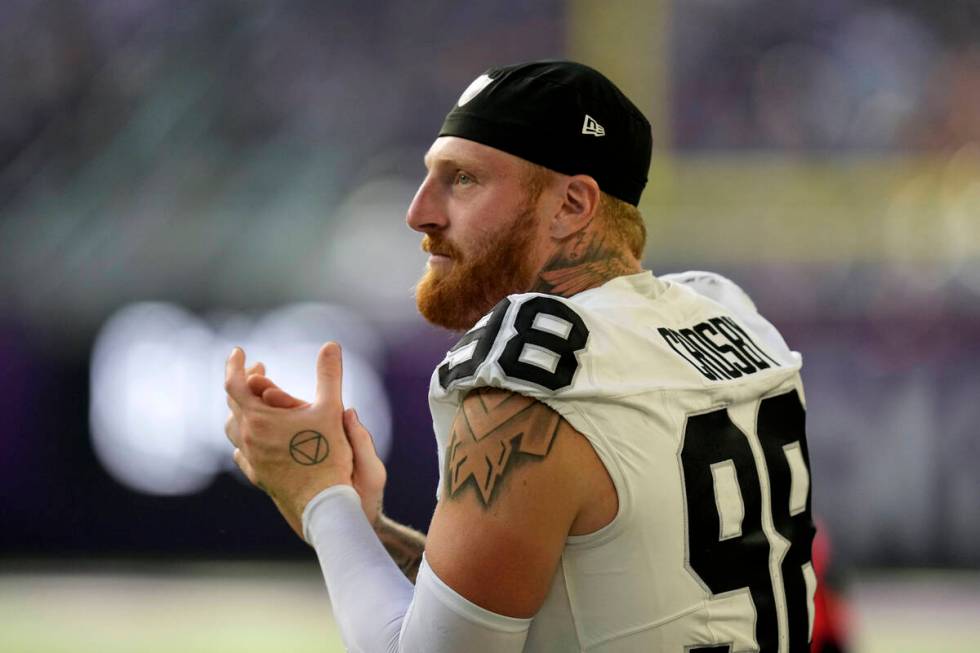 Las Vegas Raiders defensive end Maxx Crosby (98) watches from the sideline during the second ha ...