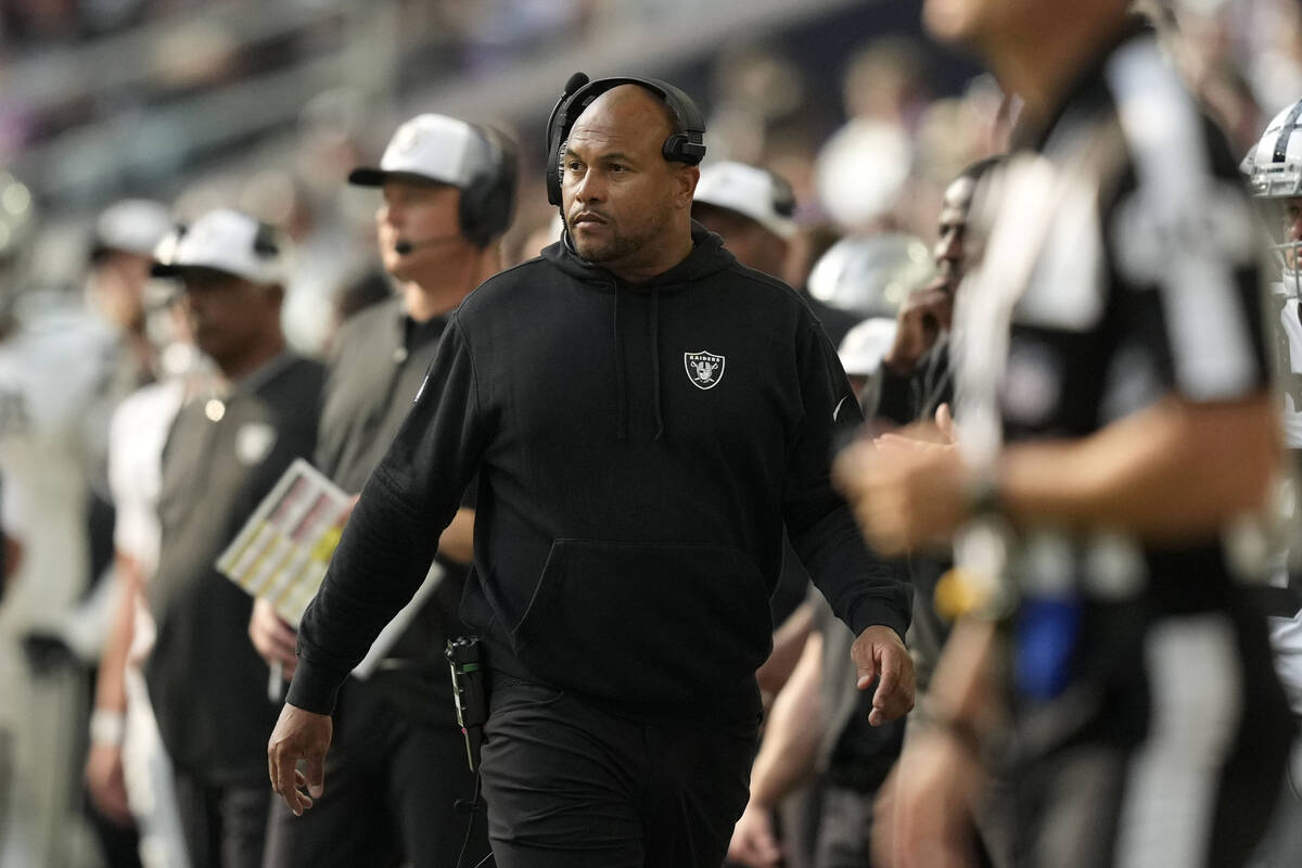 Las Vegas Raiders head coach Antonio Pierce, center, watches from the sideline during the secon ...