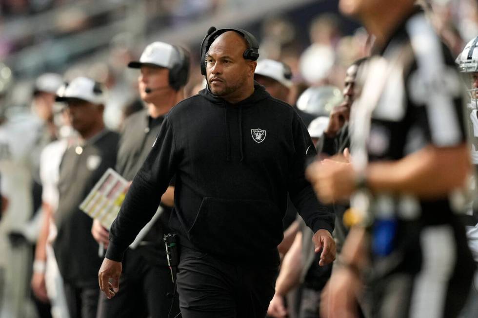 Las Vegas Raiders head coach Antonio Pierce, center, watches from the sideline during the secon ...