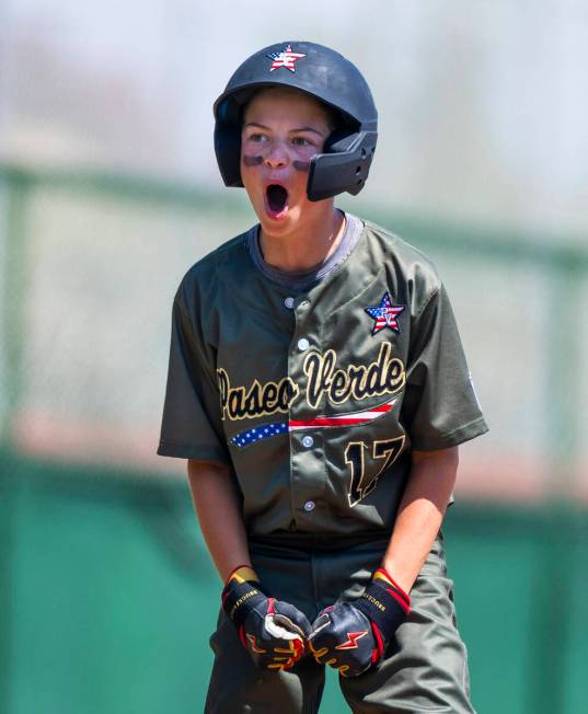 Nevada base runner Dominic Laino (17) is pumped up after safely sliding into third base agains ...