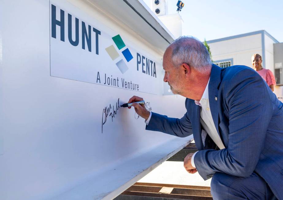 LVCVA President and CEO Steve Hill signs the beam during a topping-off ceremony for the Phase 3 ...